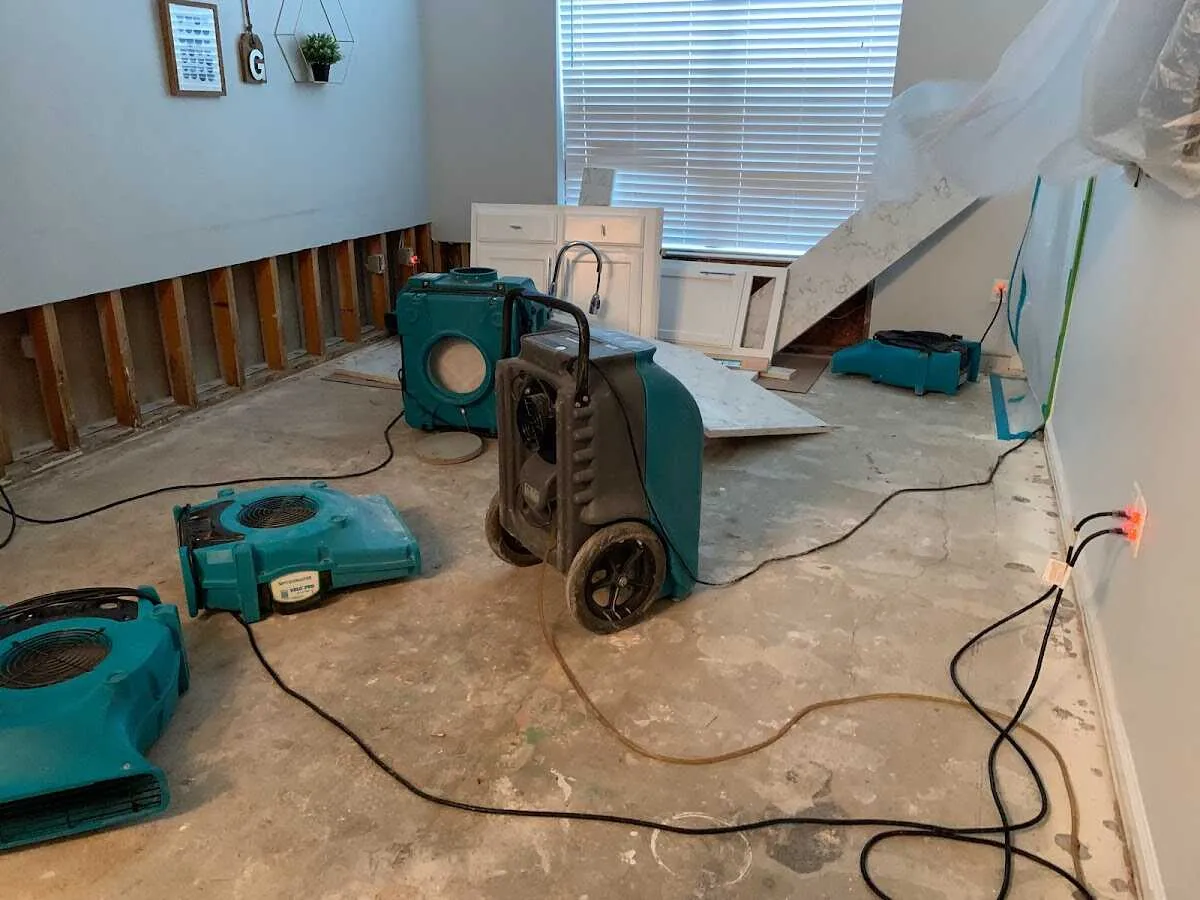 Dehumidifier in flood-cut room for Water Damage Restoration in Louisville
